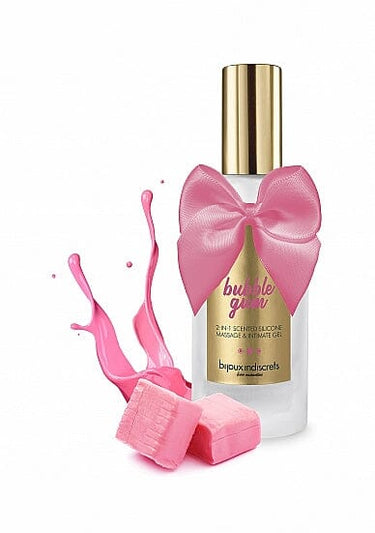 a bottle of body lotion next to a pink sponge